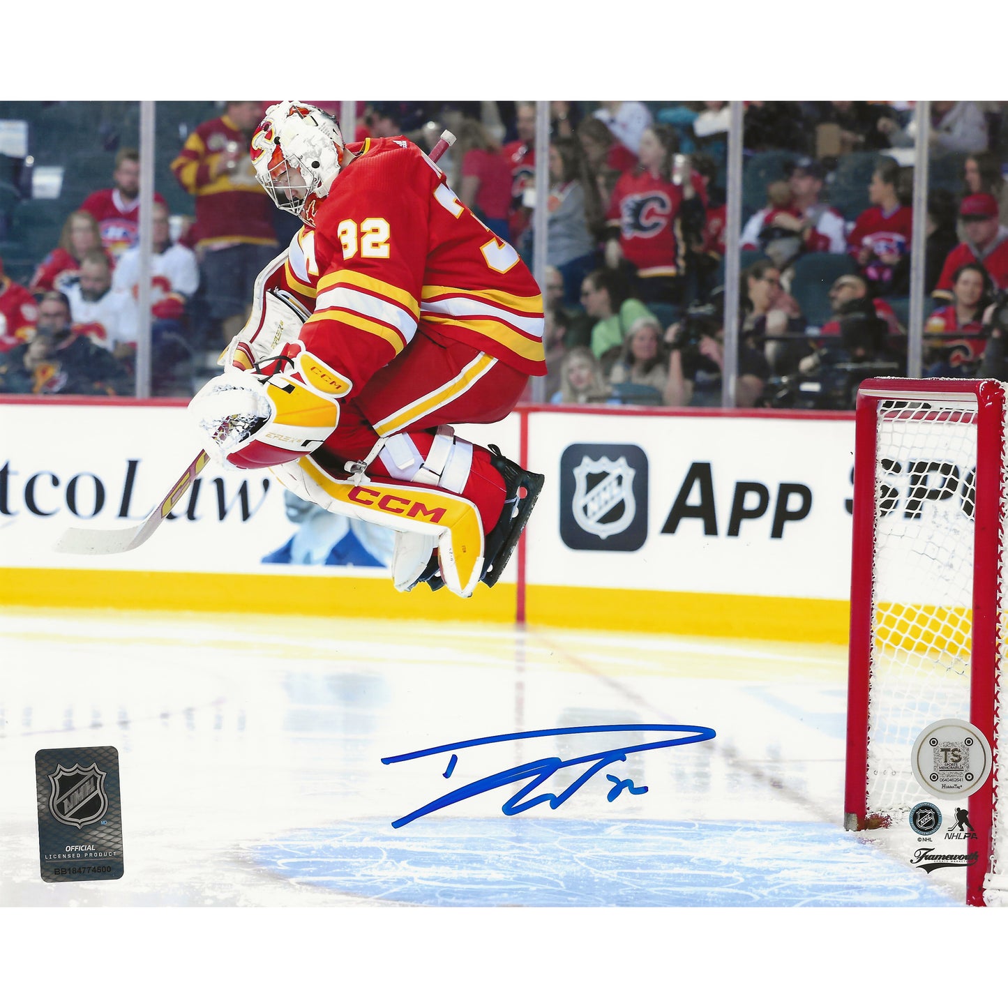 Dustin Wolf Autographed Calgary Flames Pre-Game Jump 8x10 Photo