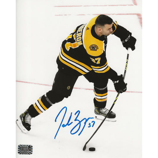 Patrice Bergeron Autographed Boston Bruins Wrist Shot 8x10 Photo